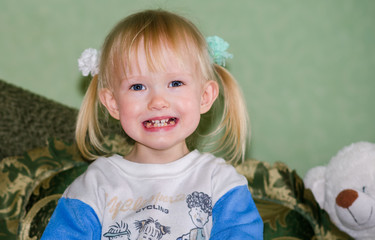 Close-Up portrait of a cheerful little girl smiling