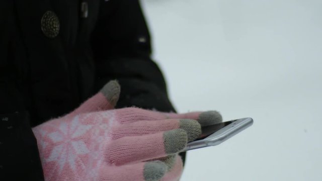 Woman Using Smartphone In Winter, Snowy Weather Day, Motion