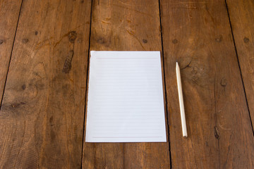 Blank page of paper on brown table
