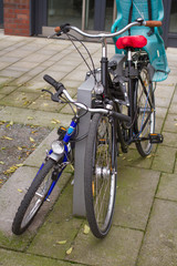 Two family bicycles standing near each other