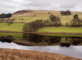 Amazing reflections and still waters on Ladybower Reservoir, Upper Derwent Valley, Derbyshire, UK