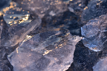 Natural ice on a lake in sunset light