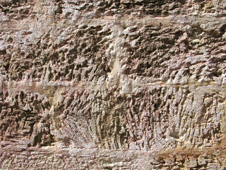 Fototapeta premium Texture of stone wall. Detail of exterior wall of the Cathedral in old town Chania on Crete island.