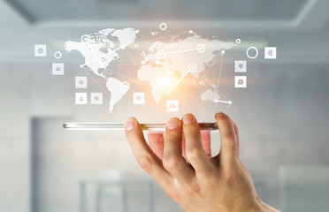 Network with his mobile phone . Mixed media