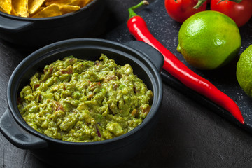 Bowl of guacamole with corn chips