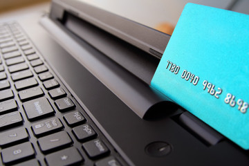 Closeup view of credit cards on laptop keyboard. online shoppin