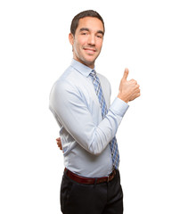 Satisfied young businessman doing an approval gesture