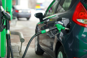 Car refueling on a petrol station in winter
