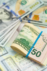 American money is on the top of the opened passport