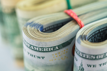 Success and got profit with pile of American dollars