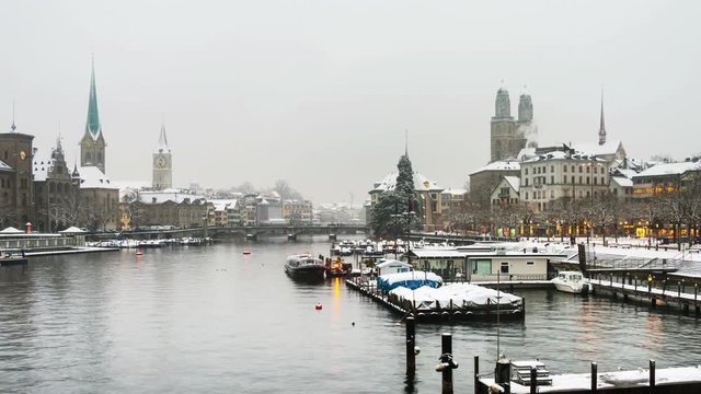 Zurich, Switzerland old town, situated on the Limmat river. Illuminated buildings in Zurich, Switzerland - the largest city in the country. Time-lapse at sunset