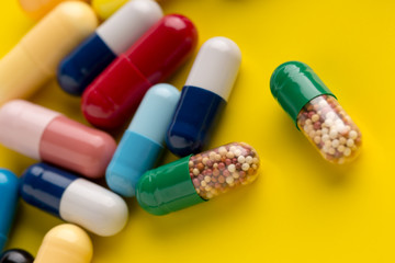 Pills different on color background