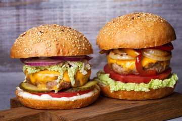 Beef burgers with red, yellow peppers, napa cabbage and cheddar