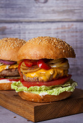 Beef burgers with red, yellow peppers, napa cabbage and cheddar