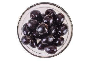 black olives in a clear glass bowl with a top view