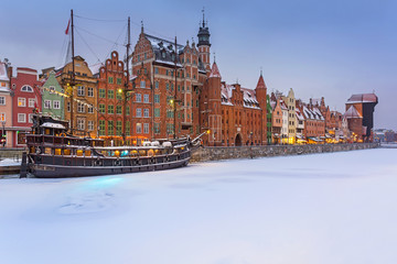 Old town of Gdansk at Motlawa river in snowy winter, Poland