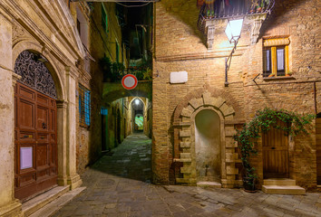 Fototapeta na wymiar Medieval narrow cozy street in Siena, Tuscany, Italy