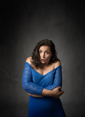 woman embracing body with arms