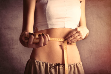 Beautiful and strong women's abs with metre nad burger.