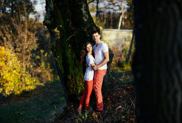 Fototapeta premium Couple in love embracing near tree