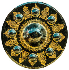 Thai Buddhist design on large vintage nipple gong. It is isolated on white background.