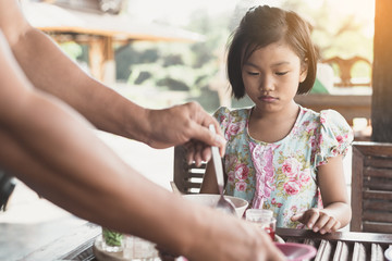 Father Serving desserts to children outdoors
