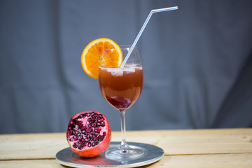 Pomegranate spray (pomegranate spritz ) on grey background