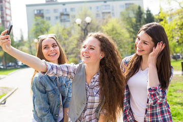 Happy teen girls having fun in street