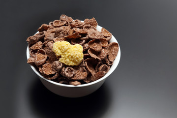 corn flakes in a white bowl.