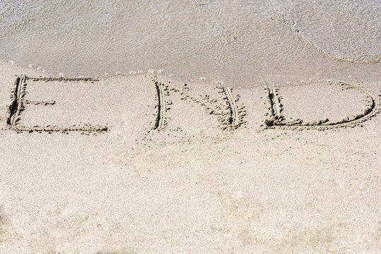 written on the sand End, concept for new year greeting cards and calendars