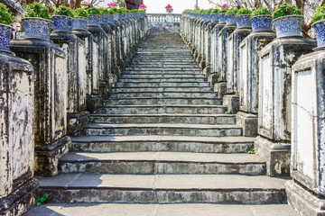 Vintage stairway decorated with ceramic pot of the Phra Nakhon Khiri. It is at a historical park in Phetchaburi, Thailand.