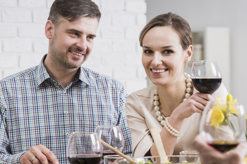 Cheerful young couple drinking wine