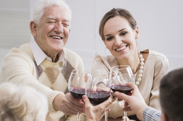 Cheerful father and daughter making a toast