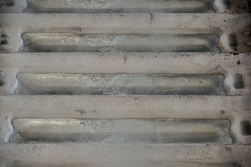 Stack of raw aluminum ingots in aluminum profiles factory