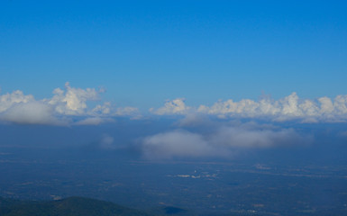 Fototapeta na wymiar clouds in the blue sky over city view