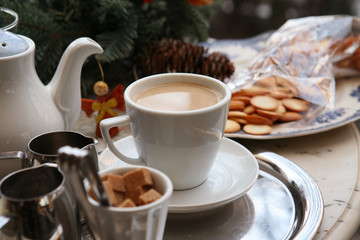 still life with milk tea, biscuits and christmas angel