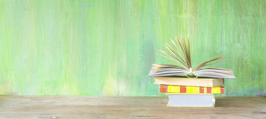 stack of books, opened book, good copy space