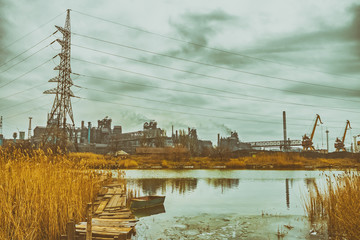 River and factory, gloomy autumn industrial landscape, pollution