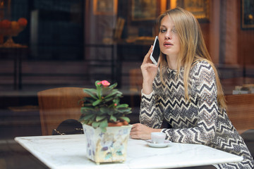 Beautiful woman calling with her smartphone