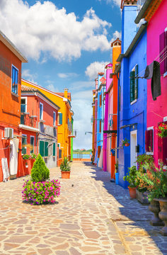 Multicolor houses with fantastic sky in background