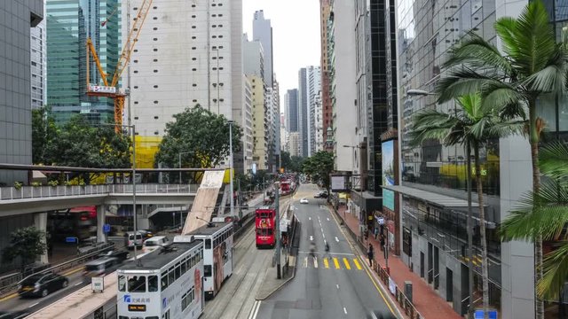 The chaotic traffic on the roads in Hong Kong Central. Time lapse.