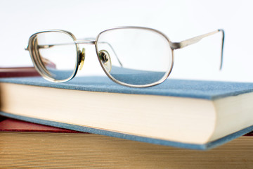 Reading glasses on top of book