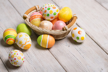 Obraz na płótnie Canvas Easter eggs on wooden