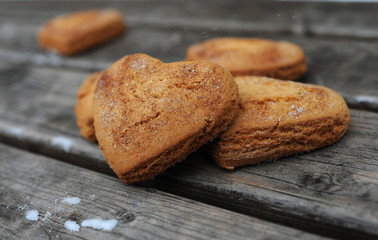 Homemade cookies with cinnamon  over wooden background
