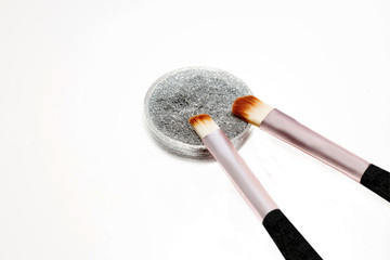 Colored circles  confetti for nail design with brush on  white background.