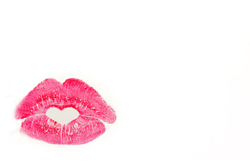 Perfect imprint of pink lipstick. Silhouette of pink lips isolated white background.