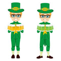 Young boy with leprechaun costume celebrating Saint Patrick day holding golden and green beer mugs