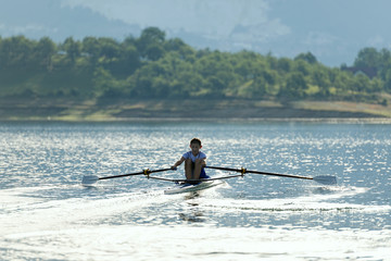 single rower at sunrise