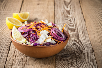 Obraz na płótnie Canvas Chinese cabbage salad with red cabbage, carrot and red onion