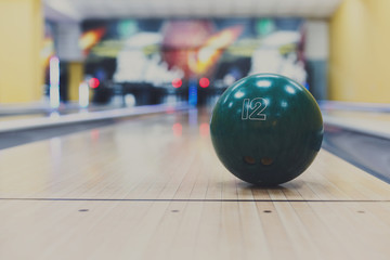 Fototapeta na wymiar Bowling ball closeup on lane background